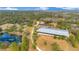 Aerial view of property with house and equestrian facilities at 2140 W State Road 46, Geneva, FL 32732