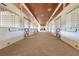 Clean and bright barn stalls with brick flooring and wood ceilings at 2140 W State Road 46, Geneva, FL 32732