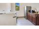 Clean laundry room with a refrigerator and microwave at 2140 W State Road 46, Geneva, FL 32732