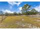 Large, grassy paddock with wooden fencing, ideal for horses at 2140 W State Road 46, Geneva, FL 32732