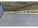 Covered riding arena with a gravel surface and seating at 2140 W State Road 46, Geneva, FL 32732