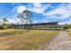 Covered riding arena with a gravel surface at 2140 W State Road 46, Geneva, FL 32732