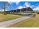 Covered riding arena with a gravel surface at 2140 W State Road 46, Geneva, FL 32732