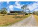 Covered riding arena with a gravel surface at 2140 W State Road 46, Geneva, FL 32732