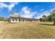 Modern horse stable with multiple stalls and covered walkways at 2140 W State Road 46, Geneva, FL 32732