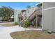 Building exterior with stairs and landscaping at 245 Scottsdale Sq # 245, Winter Park, FL 32792