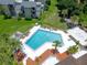 Community pool with surrounding landscaping at 245 Scottsdale Sq # 245, Winter Park, FL 32792