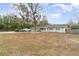 Single-story home with a spacious front yard and ample parking space available at 24908 County Road 561, Astatula, FL 34705
