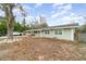 Charming single-story home featuring a well-manicured lawn and a welcoming entrance at 24908 County Road 561, Astatula, FL 34705