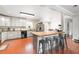 Modern kitchen with updated appliances, a spacious island, and a breakfast bar at 24908 County Road 561, Astatula, FL 34705