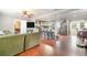Open-concept living room flowing into kitchen, featuring hardwood floors and modern finishes at 24908 County Road 561, Astatula, FL 34705