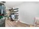 The storage area features neutral walls, dark wood floors, and metal shelving units for optimized organization at 24908 County Road 561, Astatula, FL 34705