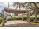 Car washing station with canopy featuring concrete columns, and a vacuum cleaner at 2740 Maitland Crossing Way # 102, Orlando, FL 32810