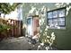 View of backyard with exterior of house and sliding door entrance to the interior at 3208 Oak Lawn Pl # 218, Winter Park, FL 32792