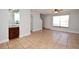 Bright living room features neutral paint, tile flooring, and a ceiling fan at 3208 Oak Lawn Pl # 218, Winter Park, FL 32792