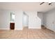 Bright living room features neutral paint, tile flooring, and a small wet bar at 3208 Oak Lawn Pl # 218, Winter Park, FL 32792