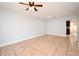 Open concept living room with neutral walls and tile floors at 3208 Oak Lawn Pl # 218, Winter Park, FL 32792