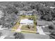 Monochrome aerial view highlighting property lines of a quaint single-Gathering home surrounded by mature trees at 3309 Drake Dr, Orlando, FL 32810