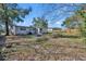 View of the backyard featuring a small fire pit and partial fencing at 3309 Drake Dr, Orlando, FL 32810