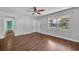 Bedroom with hardwood floors, ceiling fan and closet doors at 3309 Drake Dr, Orlando, FL 32810