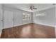 Bright living room features hardwood floors, ceiling fan and lots of natural light at 3309 Drake Dr, Orlando, FL 32810
