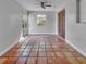 Bright sun room featuring terracotta tile flooring and natural lighting at 3309 Drake Dr, Orlando, FL 32810