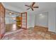 Sun room with terracotta tile and open access to the kitchen through french doors at 3309 Drake Dr, Orlando, FL 32810