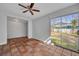 Bright sun room with terracotta tile flooring and sliding glass doors to the backyard at 3309 Drake Dr, Orlando, FL 32810