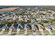 Beautiful aerial view of a residential neighborhood with well-maintained homes and lush green landscaping near a pond at 3608 Mount Hope Loop, Leesburg, FL 34748
