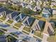 Aerial view of homes in a neighborhood with mature landscaping at 3608 Mount Hope Loop, Leesburg, FL 34748