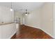 Inviting living area featuring sleek wood floors and neutral walls, creating a bright and open ambiance at 3608 Mount Hope Loop, Leesburg, FL 34748