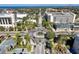 Aerial shot of a scenic roundabout near downtown with landscaped green spaces and businesses at 418 N Barrow Ave, Tavares, FL 32778