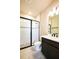 Elegant bathroom with tiled shower, modern fixtures, and stylish vanity at 4425 Lions Gate Ave, Clermont, FL 34711