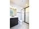 Modern bathroom with stylish vanity, sleek fixtures, and frameless shower at 4425 Lions Gate Ave, Clermont, FL 34711