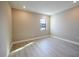 Empty bedroom with hardwood floors and a window at 4425 Lions Gate Ave, Clermont, FL 34711