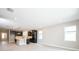 Spacious open floor plan with bright kitchen featuring an island, modern fixtures, and stainless steel appliances at 4425 Lions Gate Ave, Clermont, FL 34711