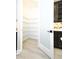 Walk-in pantry with open shelving for optimal storage and organization at 4425 Lions Gate Ave, Clermont, FL 34711