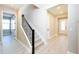 Staircase features wood-look floors and dark balusters at 4425 Lions Gate Ave, Clermont, FL 34711