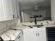 Modern kitchen with white cabinets and quartz countertops at 4854 S Semoran Blvd # 2203, Orlando, FL 32822