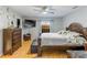 Main bedroom with wood bed frame and ceiling fan at 5422 Reata Way, Orlando, FL 32810