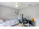 Simple bedroom with a twin bed, desk, and mirror at 5422 Reata Way, Orlando, FL 32810