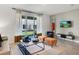 Comfortable living room featuring a gray sofa and sliding glass doors at 660 Preston Cove Dr, St Cloud, FL 34771