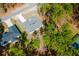 Aerial view of gray roofed single Gathering home with long driveway and many trees nearby at 6732 Sw 132Nd St, Ocala, FL 34473