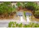 Lovely single Gathering home with neutral colors, long driveway, and situated near many large trees at 6732 Sw 132Nd St, Ocala, FL 34473