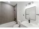 Beautiful bathroom featuring modern fixtures, sleek design, and a tub-shower combination with stylish tile surround at 6732 Sw 132Nd St, Ocala, FL 34473