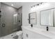Beautiful bathroom with double sinks, modern lighting, and glass shower at 6732 Sw 132Nd St, Ocala, FL 34473