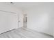 Bedroom with a large closet and wood-look flooring at 6732 Sw 132Nd St, Ocala, FL 34473