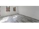 Inviting bedroom featuring two bright windows offering natural light and nice flooring at 6732 Sw 132Nd St, Ocala, FL 34473