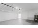 Clean and well-lit two car garage featuring ample storage space at 6732 Sw 132Nd St, Ocala, FL 34473