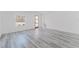 Bright living room featuring wood-look floors and lots of natural light at 6732 Sw 132Nd St, Ocala, FL 34473